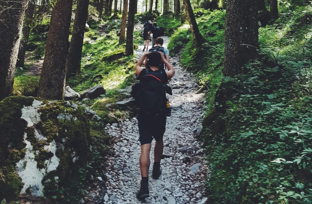 Fitness business owner enjoying free time hiking in nature
