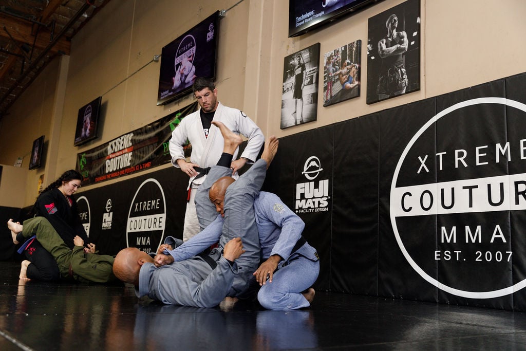 New jiu-jitsu students learn movements and celebrate wins